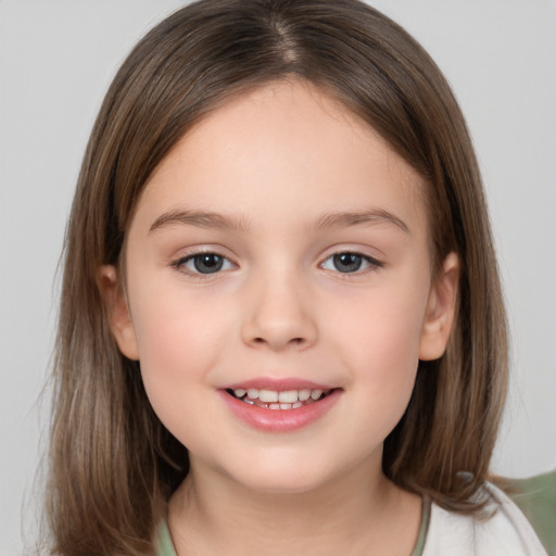 Joyful white child female with medium  brown hair and brown eyes