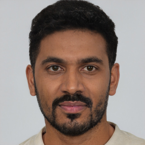 Neutral black young-adult male with short  black hair and brown eyes