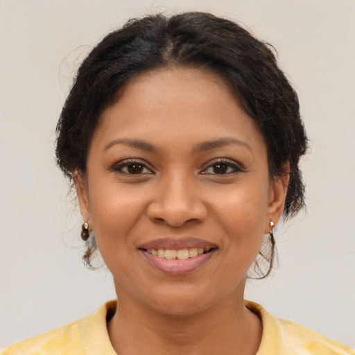 Joyful latino young-adult female with short  brown hair and brown eyes