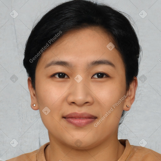 Joyful asian young-adult female with short  black hair and brown eyes