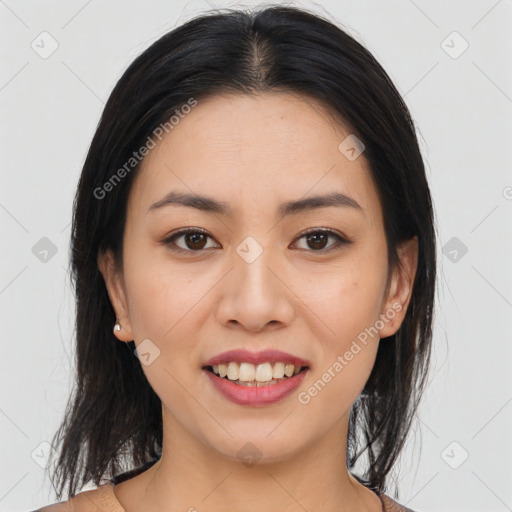 Joyful asian young-adult female with long  brown hair and brown eyes