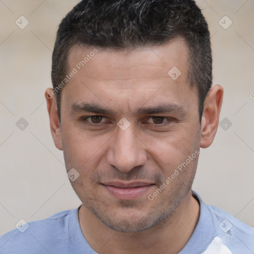 Joyful white adult male with short  brown hair and brown eyes