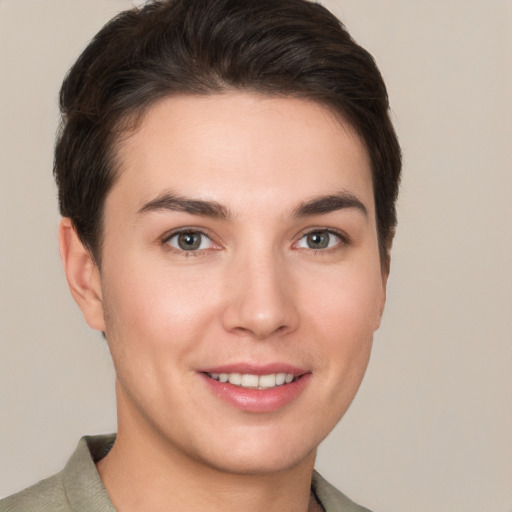 Joyful white young-adult female with short  brown hair and brown eyes