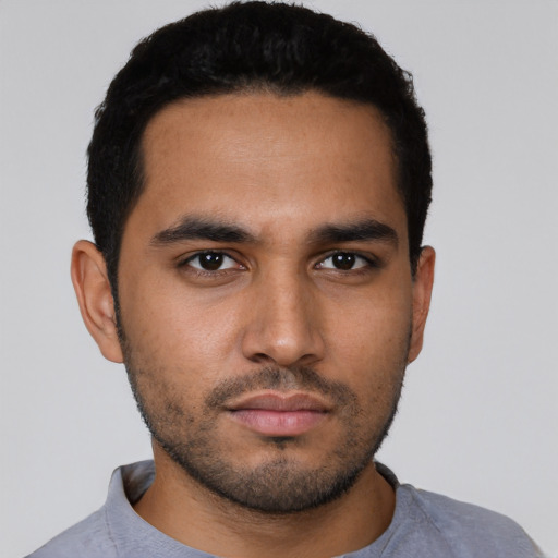 Neutral latino young-adult male with short  black hair and brown eyes