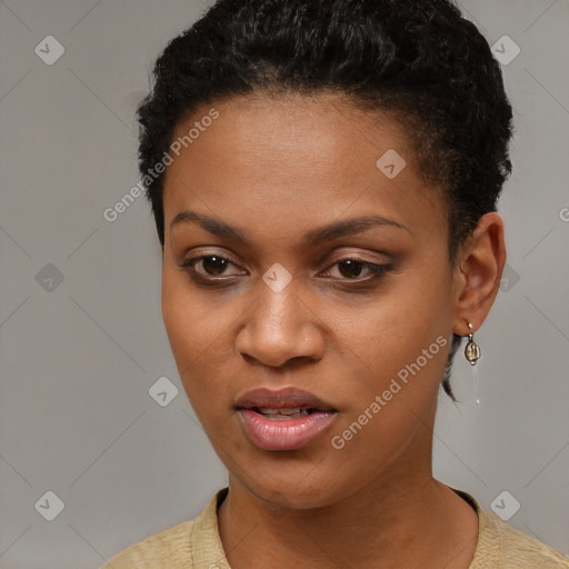 Joyful black young-adult female with short  black hair and brown eyes