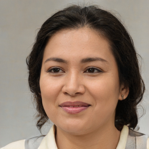 Joyful white young-adult female with medium  brown hair and brown eyes