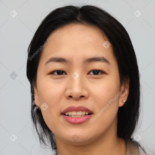 Joyful asian young-adult female with medium  black hair and brown eyes