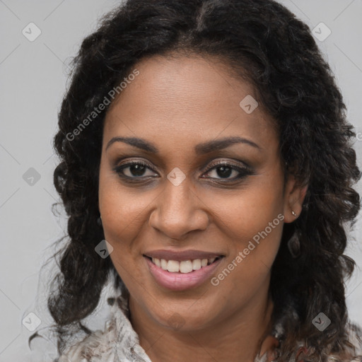 Joyful black young-adult female with long  brown hair and brown eyes