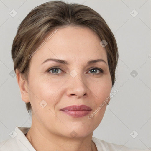 Joyful white adult female with short  brown hair and grey eyes