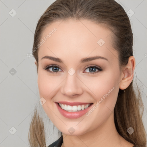 Joyful white young-adult female with long  brown hair and grey eyes