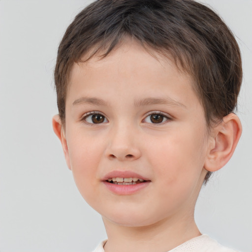 Joyful white child male with short  brown hair and brown eyes