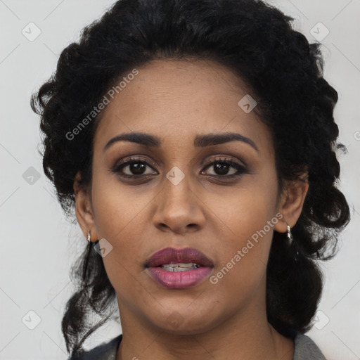 Joyful latino young-adult female with long  black hair and brown eyes