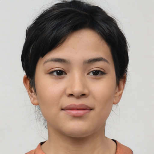 Joyful asian young-adult female with medium  black hair and brown eyes