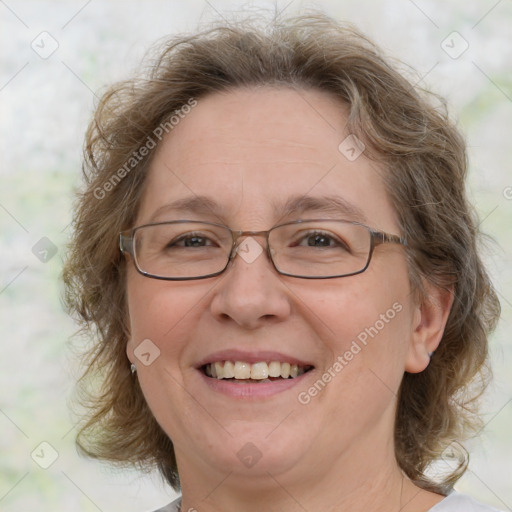 Joyful white adult female with medium  brown hair and blue eyes