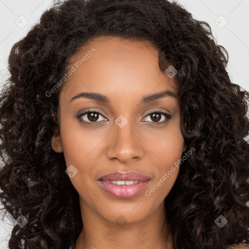 Joyful black young-adult female with long  brown hair and brown eyes