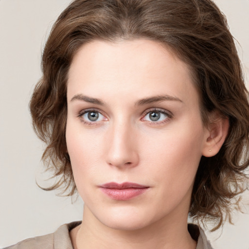 Neutral white young-adult female with medium  brown hair and green eyes