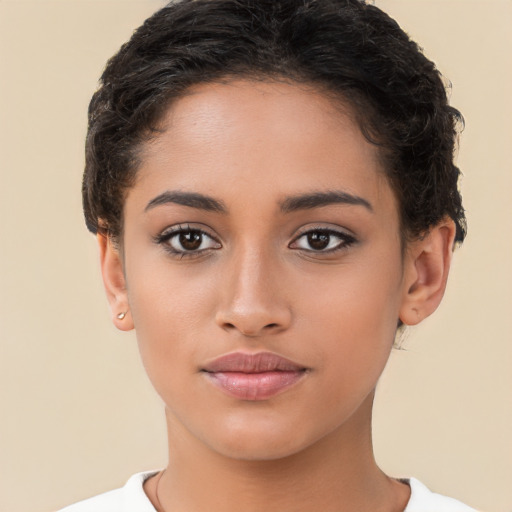 Joyful latino young-adult female with short  brown hair and brown eyes