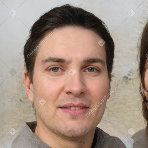 Joyful white adult male with short  brown hair and brown eyes