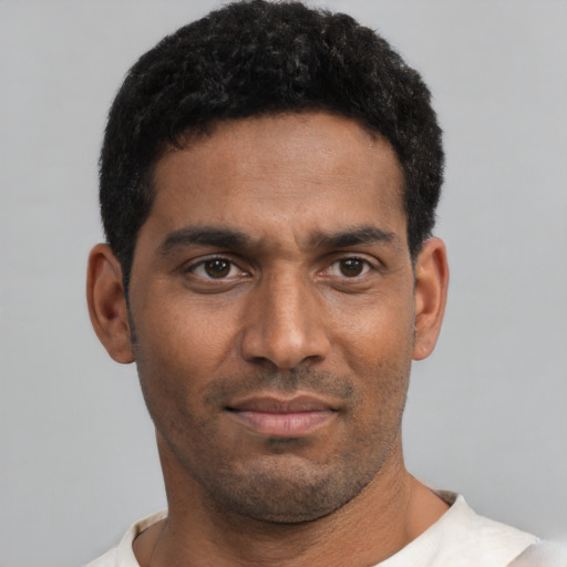 Neutral black young-adult male with short  black hair and brown eyes