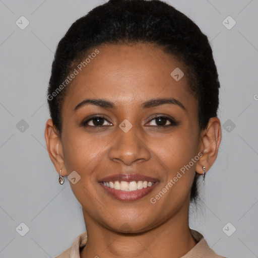 Joyful black young-adult female with short  brown hair and brown eyes