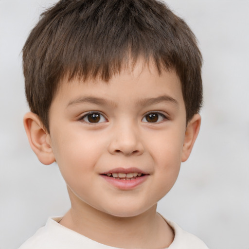 Joyful white child male with short  brown hair and brown eyes