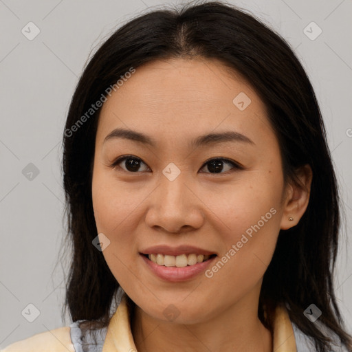 Joyful asian young-adult female with long  brown hair and brown eyes