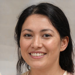 Joyful white adult female with medium  brown hair and brown eyes