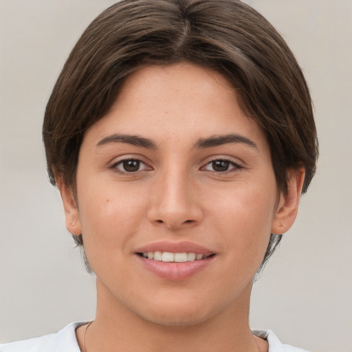 Joyful white young-adult female with short  brown hair and brown eyes