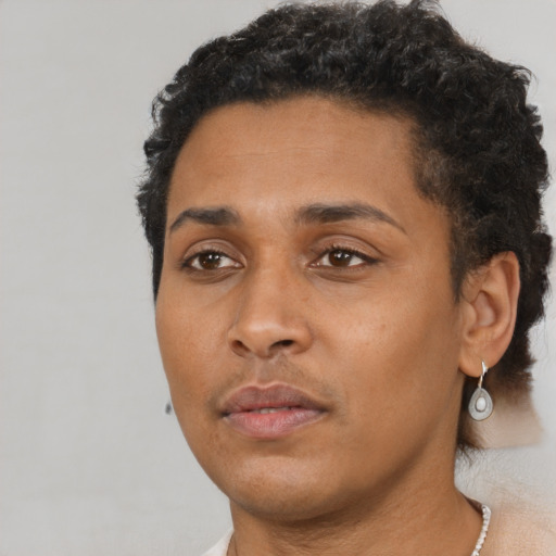 Neutral black young-adult female with short  black hair and brown eyes