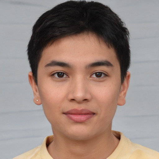 Joyful asian young-adult male with short  brown hair and brown eyes