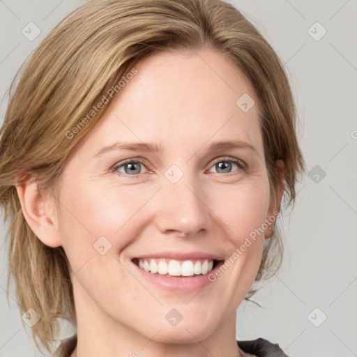 Joyful white young-adult female with medium  brown hair and blue eyes