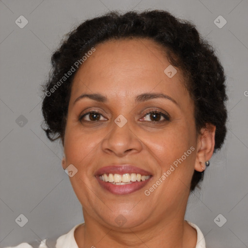 Joyful latino adult female with short  brown hair and brown eyes