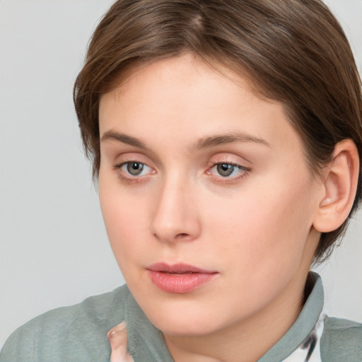 Neutral white young-adult female with short  brown hair and brown eyes