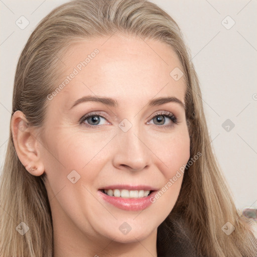 Joyful white young-adult female with long  brown hair and grey eyes