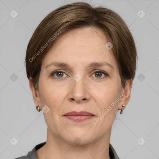 Joyful white adult female with short  brown hair and grey eyes