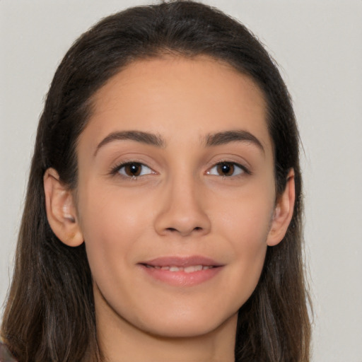 Joyful white young-adult female with long  brown hair and brown eyes