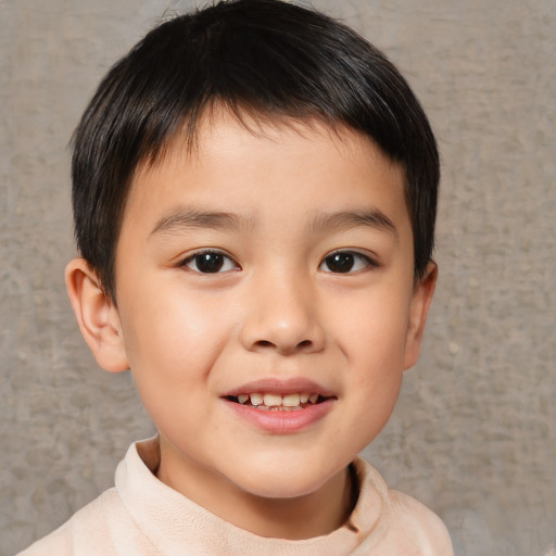 Joyful white child male with short  brown hair and brown eyes