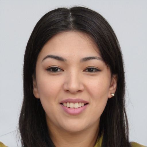 Joyful asian young-adult female with long  brown hair and brown eyes