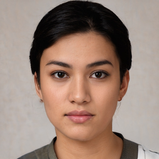 Neutral white young-adult female with short  black hair and brown eyes