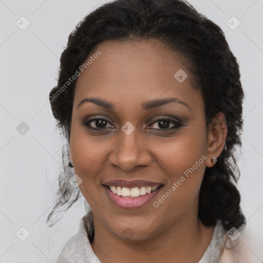 Joyful black young-adult female with medium  brown hair and brown eyes