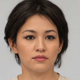 Neutral asian young-adult female with medium  brown hair and brown eyes