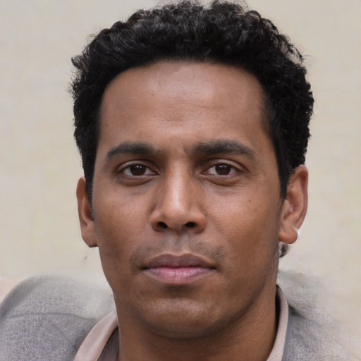 Neutral black young-adult male with short  black hair and brown eyes