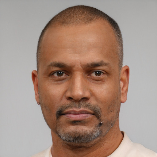 Neutral latino adult male with short  brown hair and brown eyes
