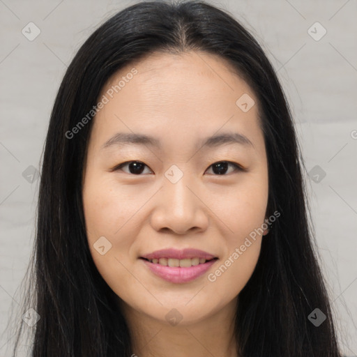 Joyful asian young-adult female with long  brown hair and brown eyes