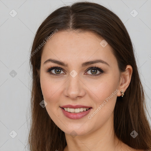 Joyful white young-adult female with long  brown hair and brown eyes