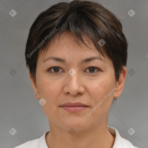 Joyful white adult female with short  brown hair and brown eyes