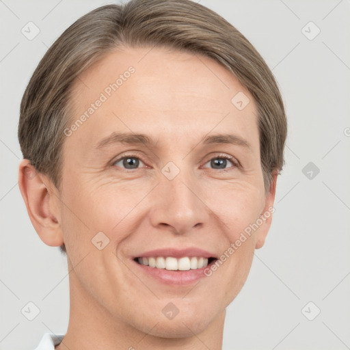 Joyful white adult female with short  brown hair and grey eyes