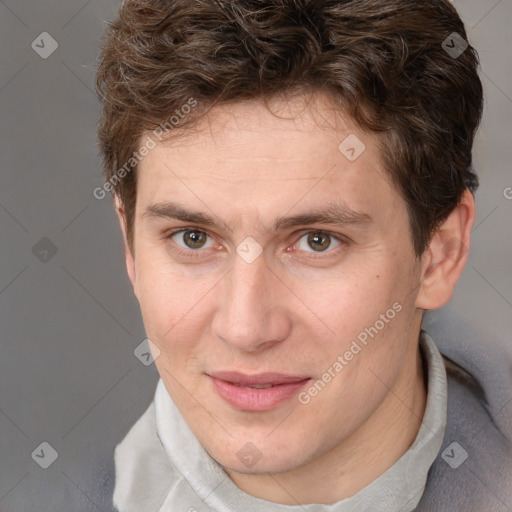 Joyful white adult male with short  brown hair and grey eyes