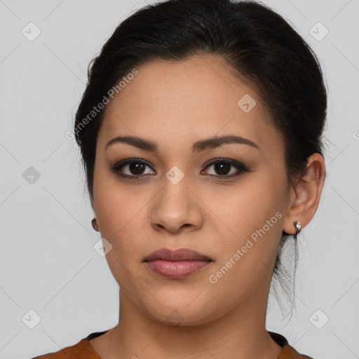 Joyful latino young-adult female with long  brown hair and brown eyes