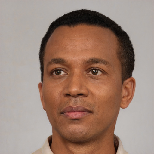 Neutral black adult male with short  black hair and brown eyes